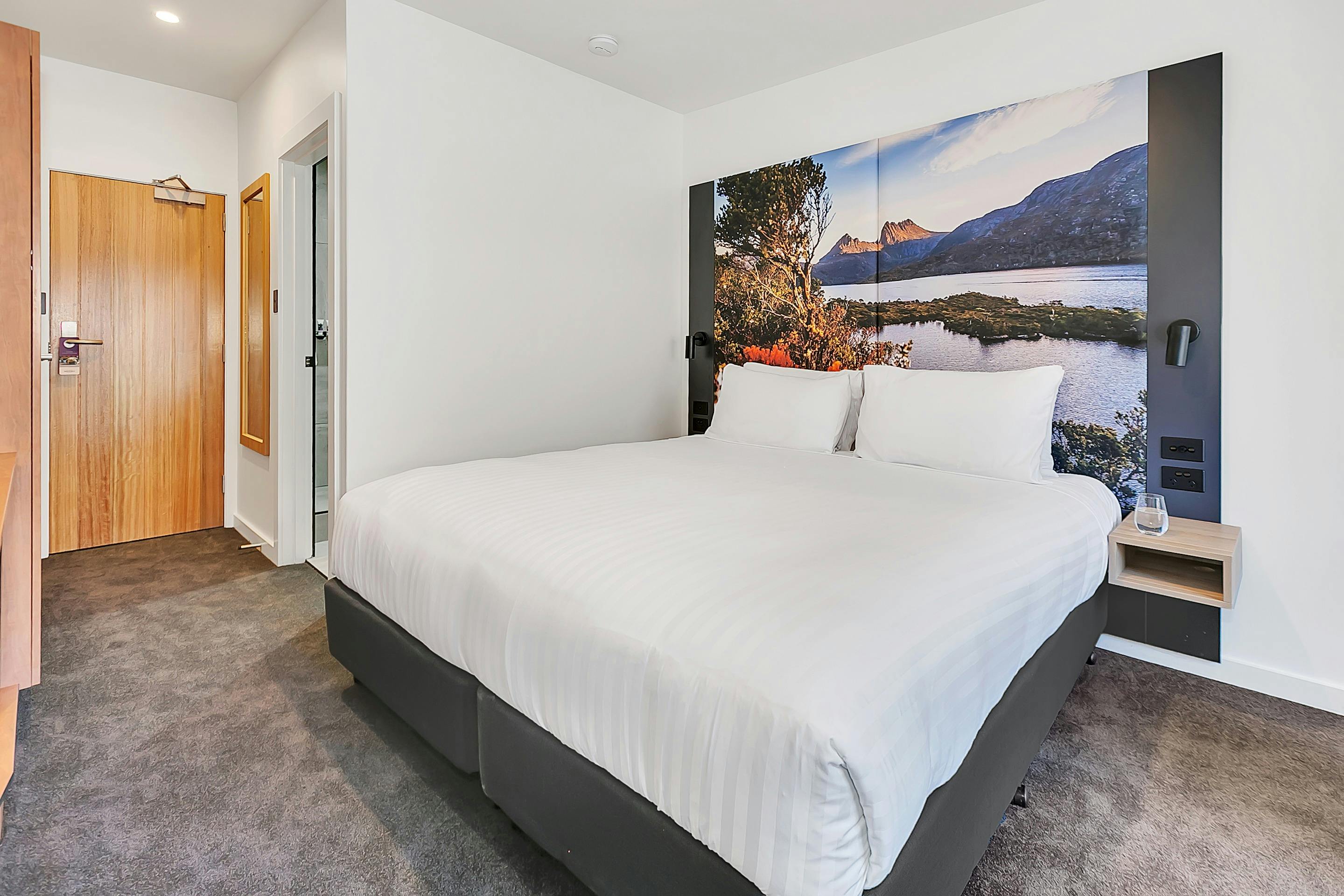 Guest accommodation room, with king bed and large picture bedhead.