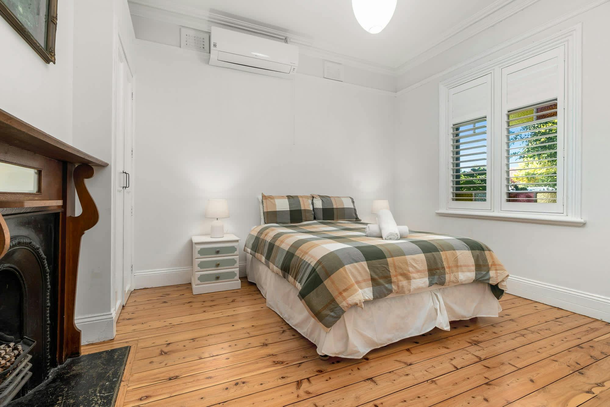 Queen bed at the second bedroom with colour full linen