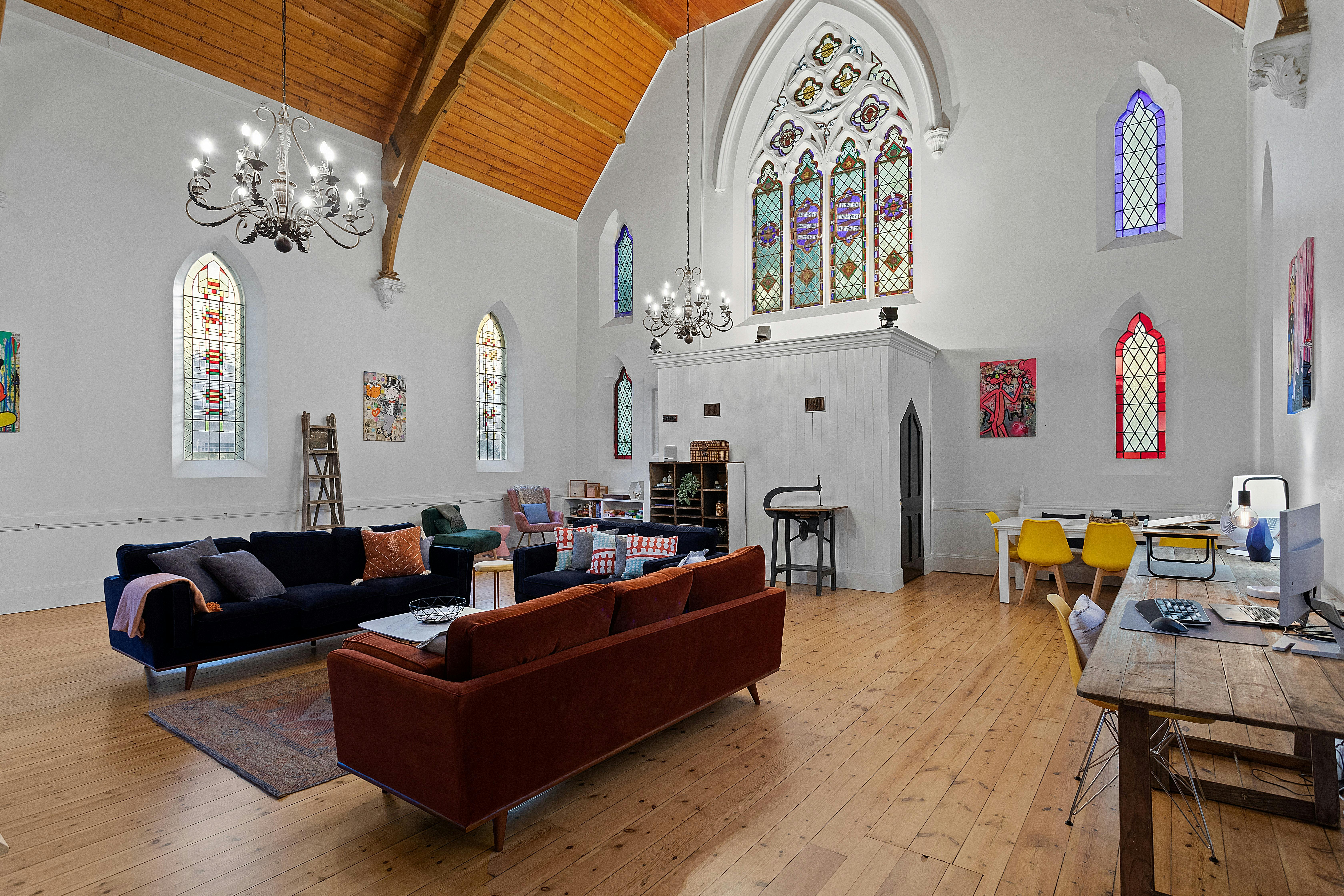Sanctuary with original stained glass windows