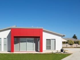 Front of Red Fin, fully enclosed back yard and long drive way