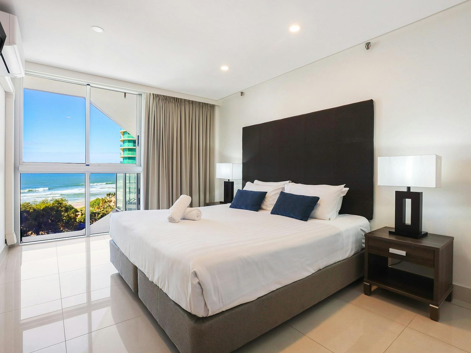 Master bedroom with King bed, ensuite, floor to ceiling windows and wardrobe cabinet - Gold Coast Master bedroom with King bed, ensuite, floor to ceiling windows and wardrobe cabinet - Gold Coast