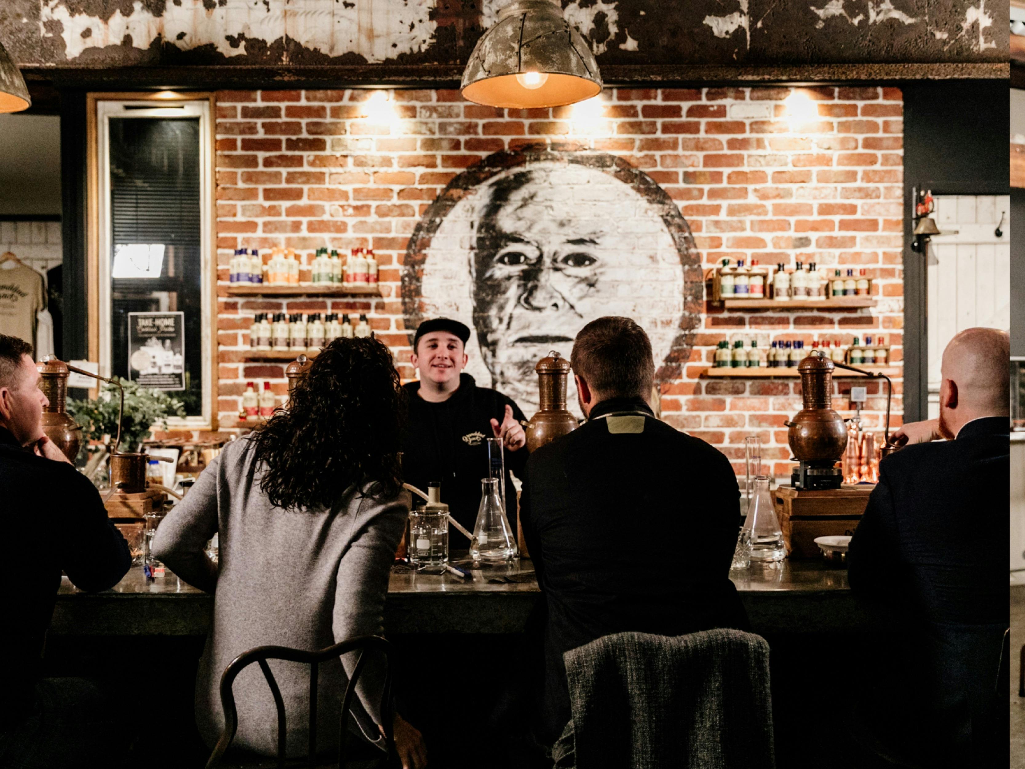 Guests at the Tasting Room bar enjoying their evening at the distillery experience.