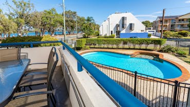 Balcony overlooking pool and Pumicestone Passage