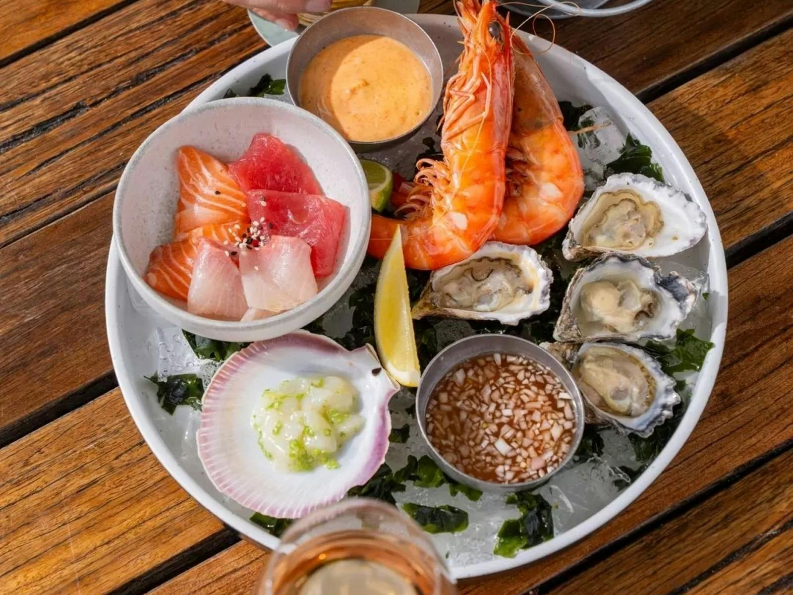 Seafood and drinks on timber table