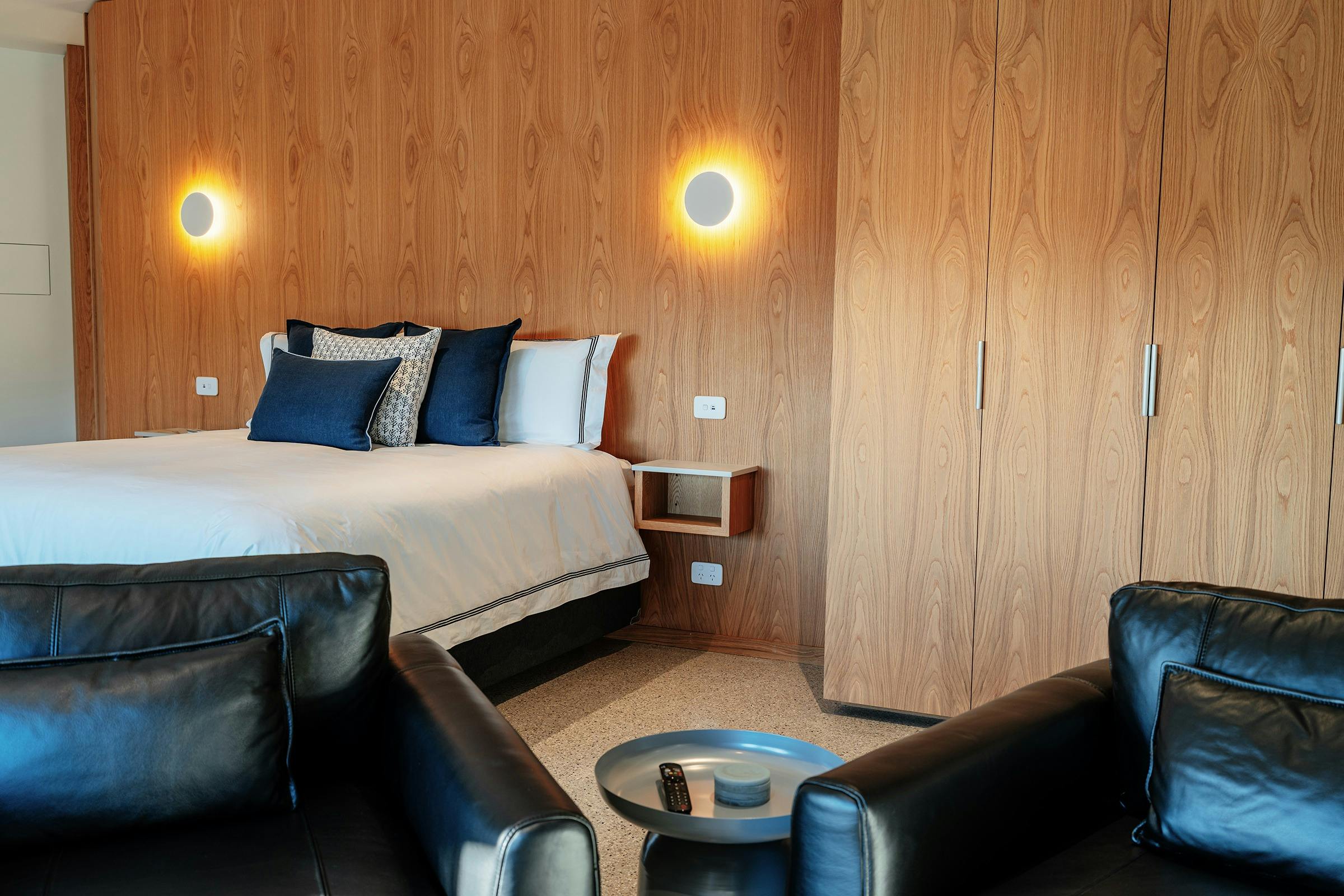 Bed and lounge chairs at Retreat Studio at Chrismont, King Valley, Victoria's High Country