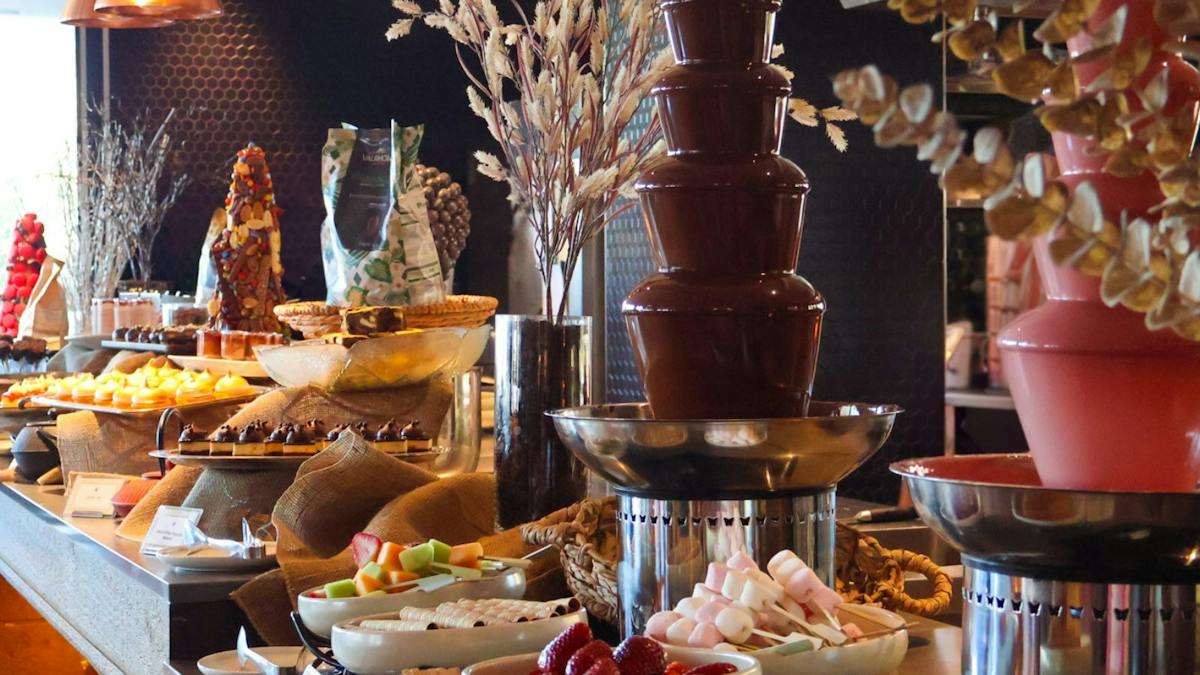 Chocolate Afternoon Tea Buffet line up of sweet treats, savouries anchocolate & strawberry fountains