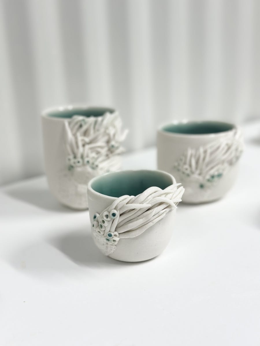 3 porcelain cups with ocean inspired texture
