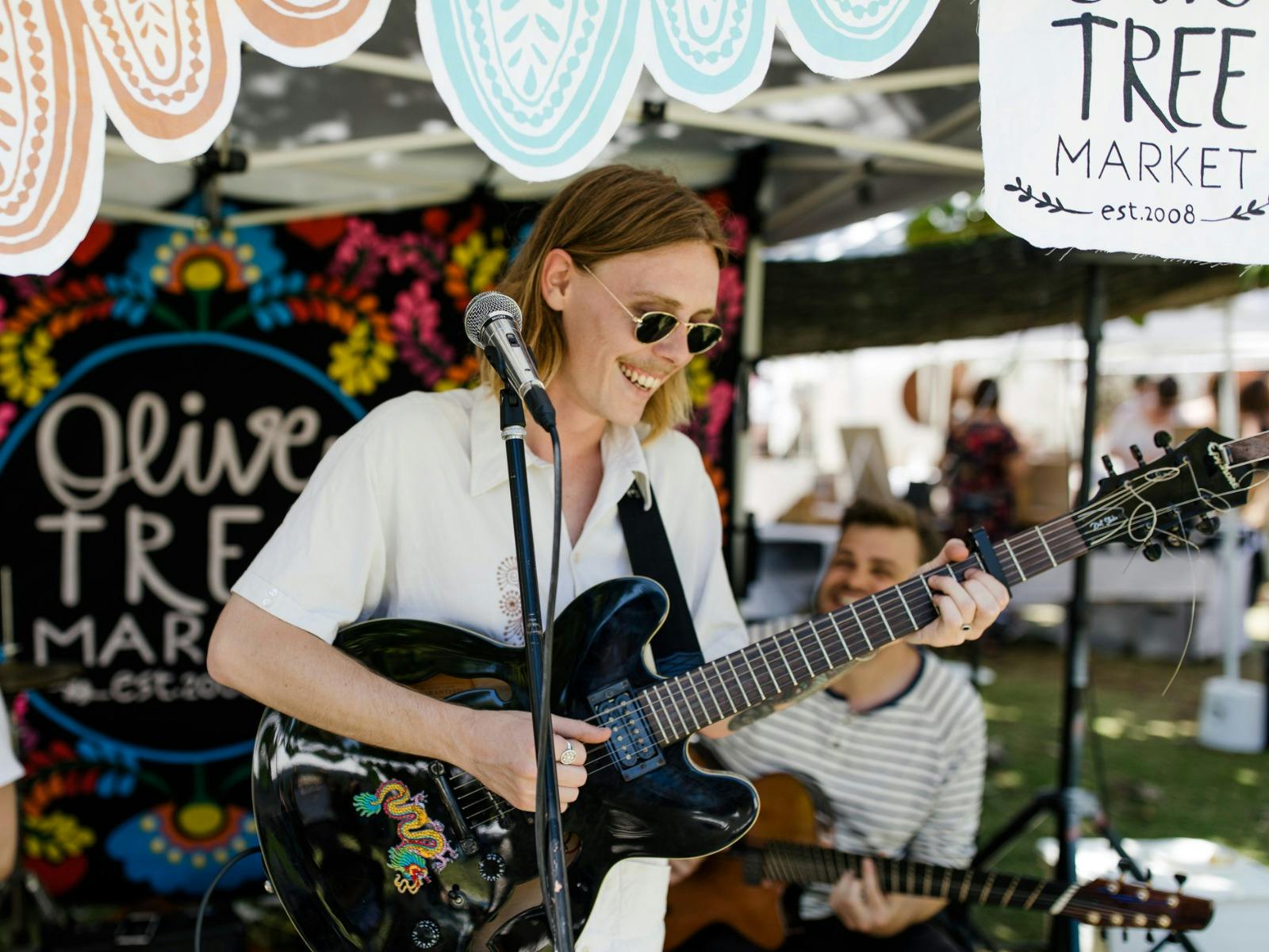 Musician Bodie Performing at The Olive Tree Market