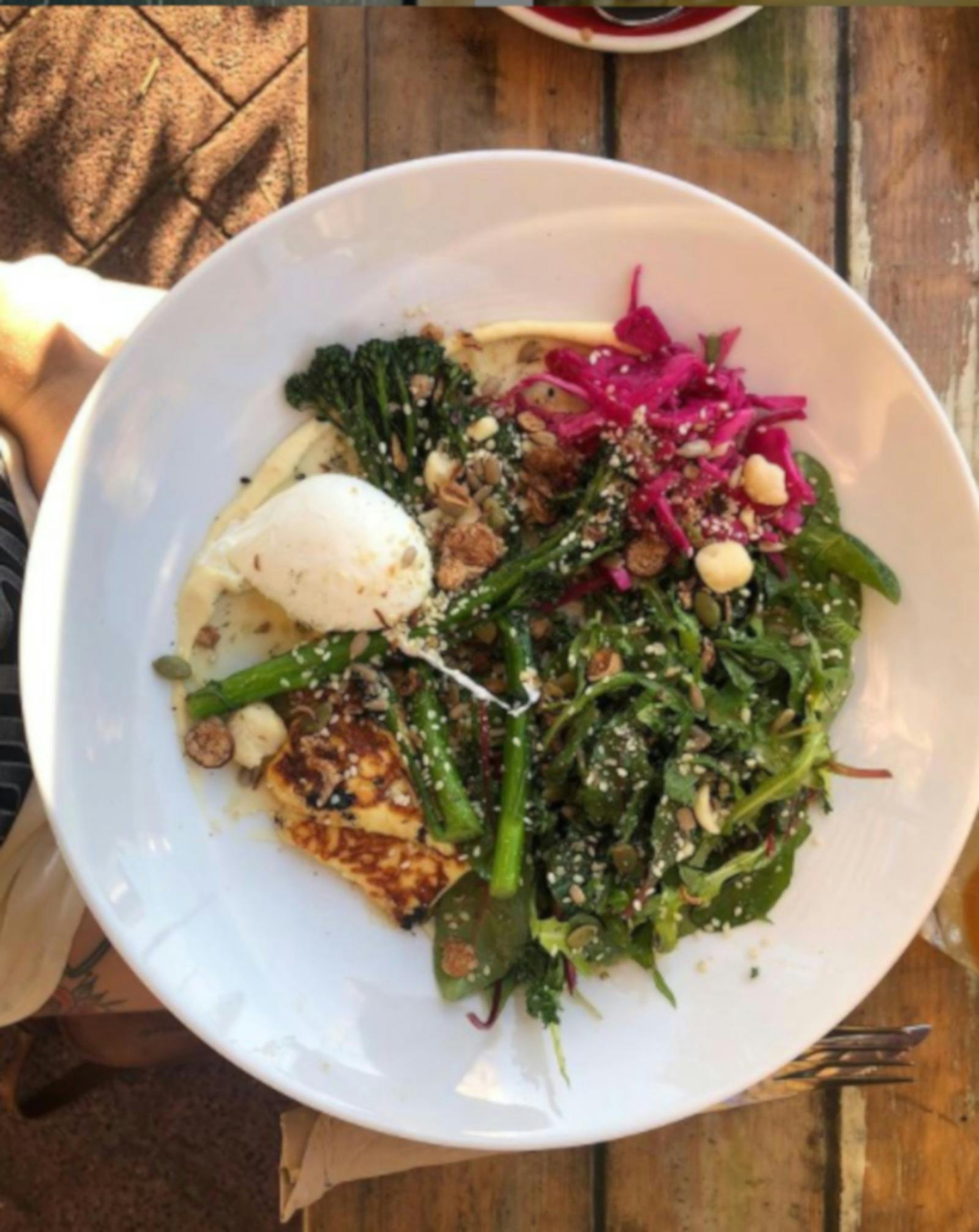 photo of beautifully presented meal of greens, beetroot and egg