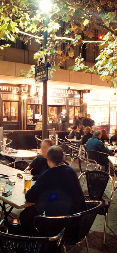 Beer garden full of patrons at night