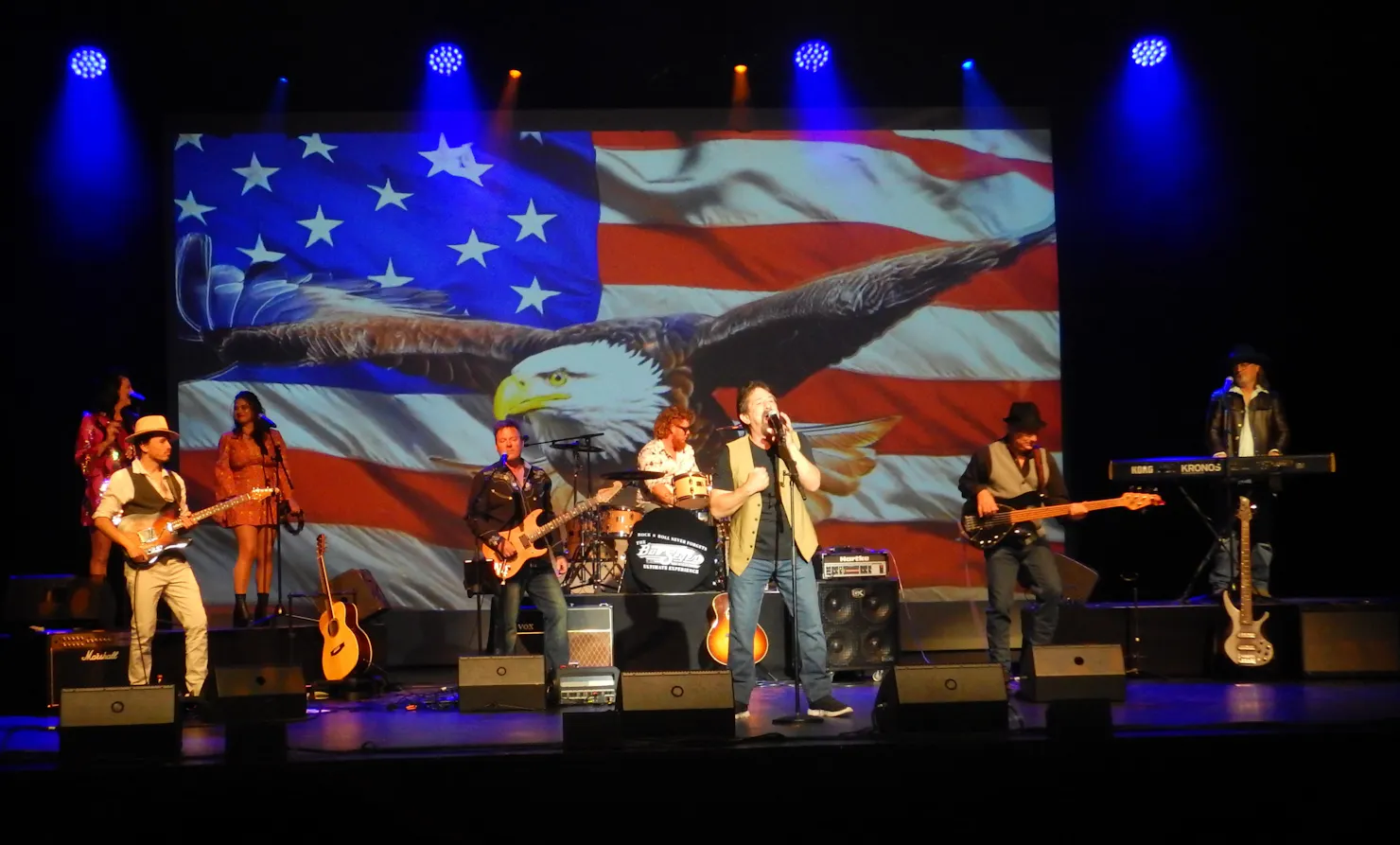 8 piece band 2 backup female singers 3 guitar players drums keyboard and lead singer