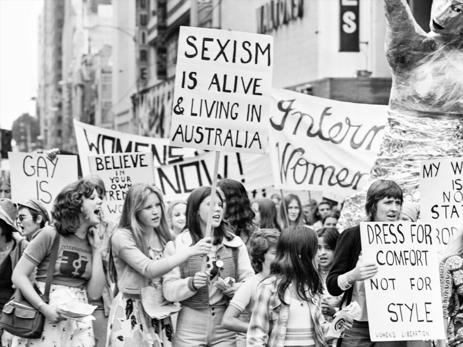 Black and white photograph of a group of people protesting at a march