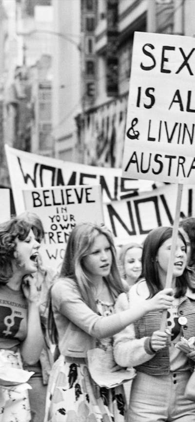 Black and white photograph of a group of people protesting at a march