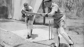 1943 - Sqn Leader Bluey Truscott batting, Flying Officer EB Tainton keeping.