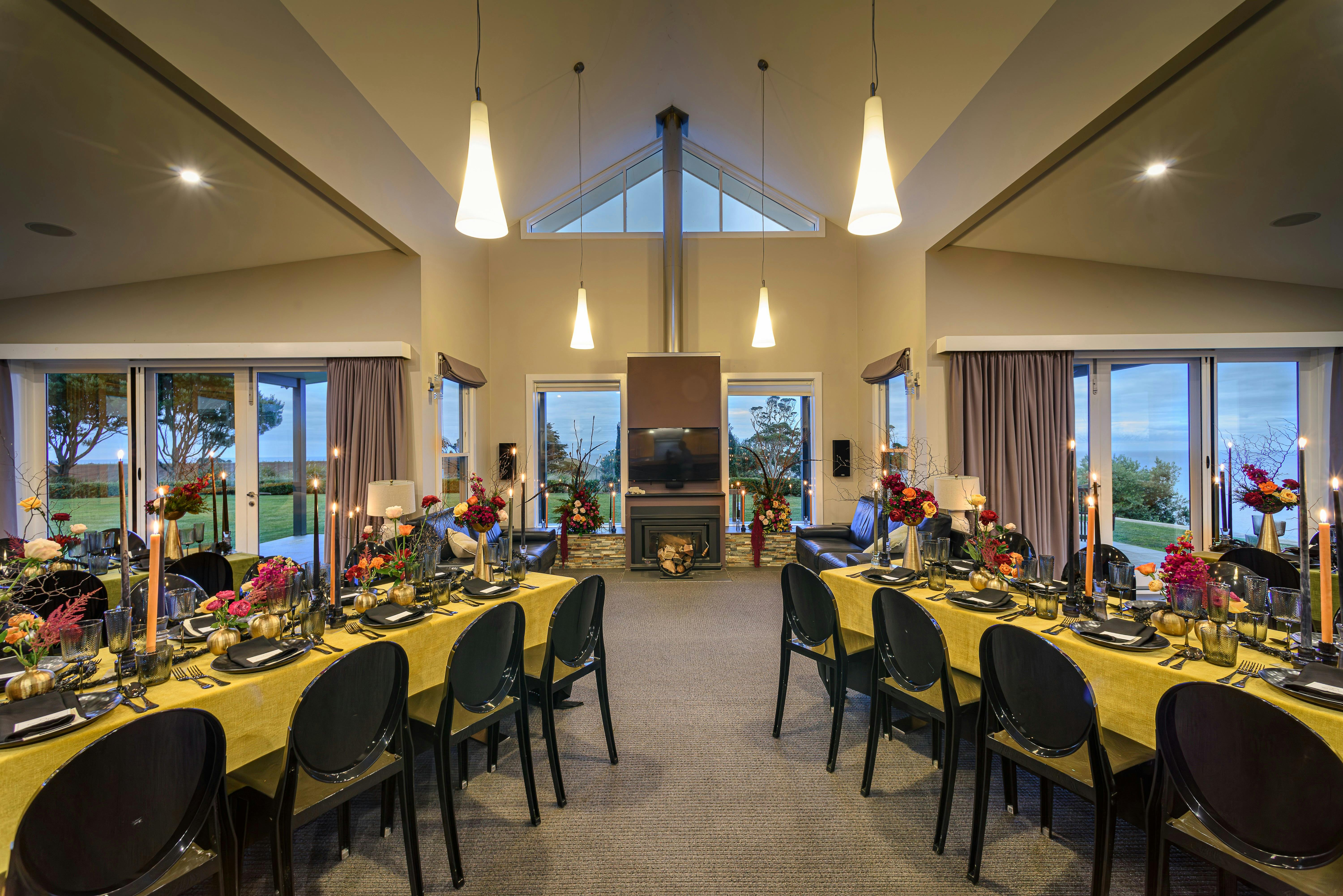 Table House living room with dining tables styled opulently for black tie dinner and show