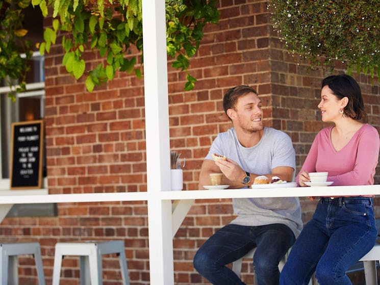 Couple enjoying meal on veranda