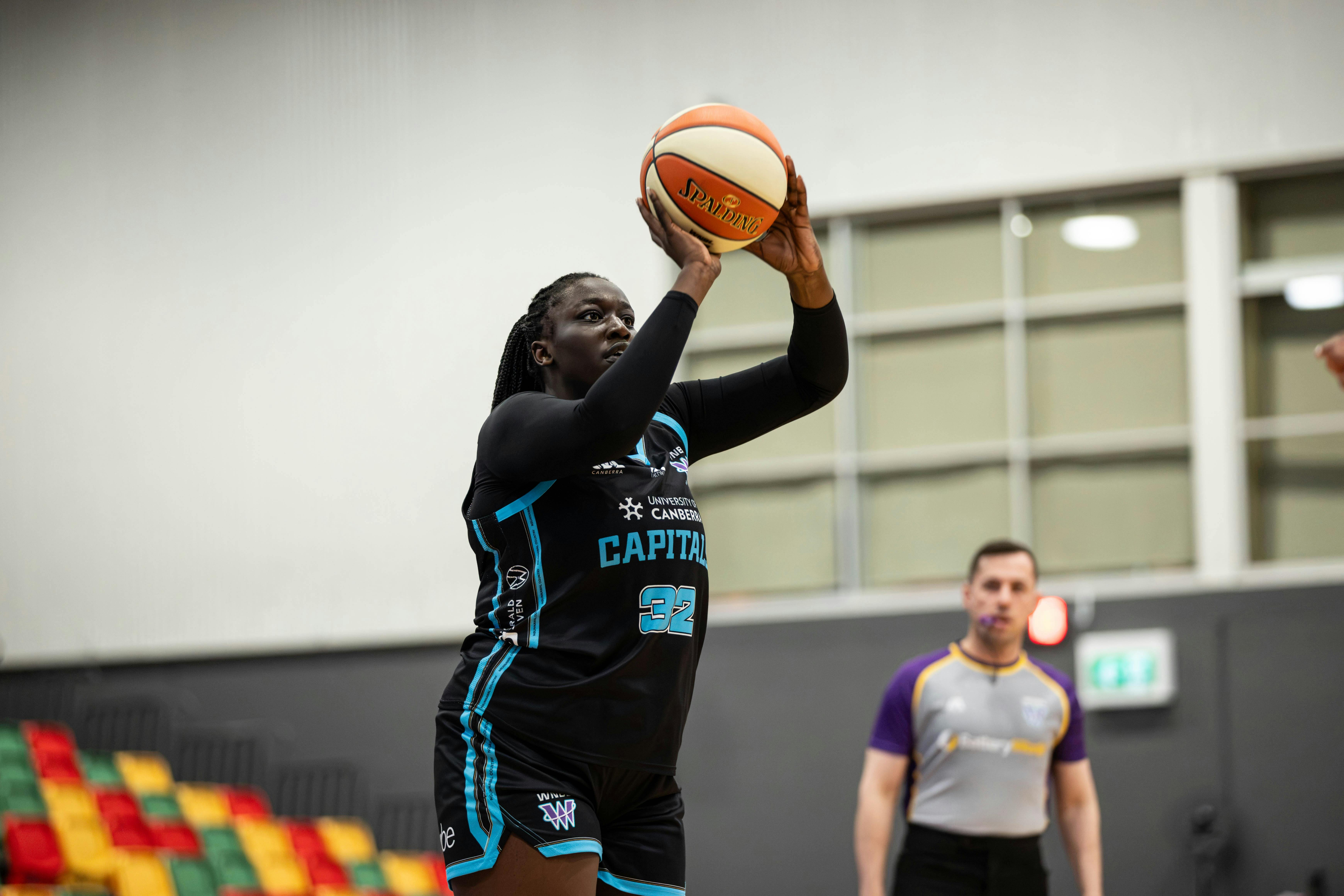 Basketball player shoots the ball.