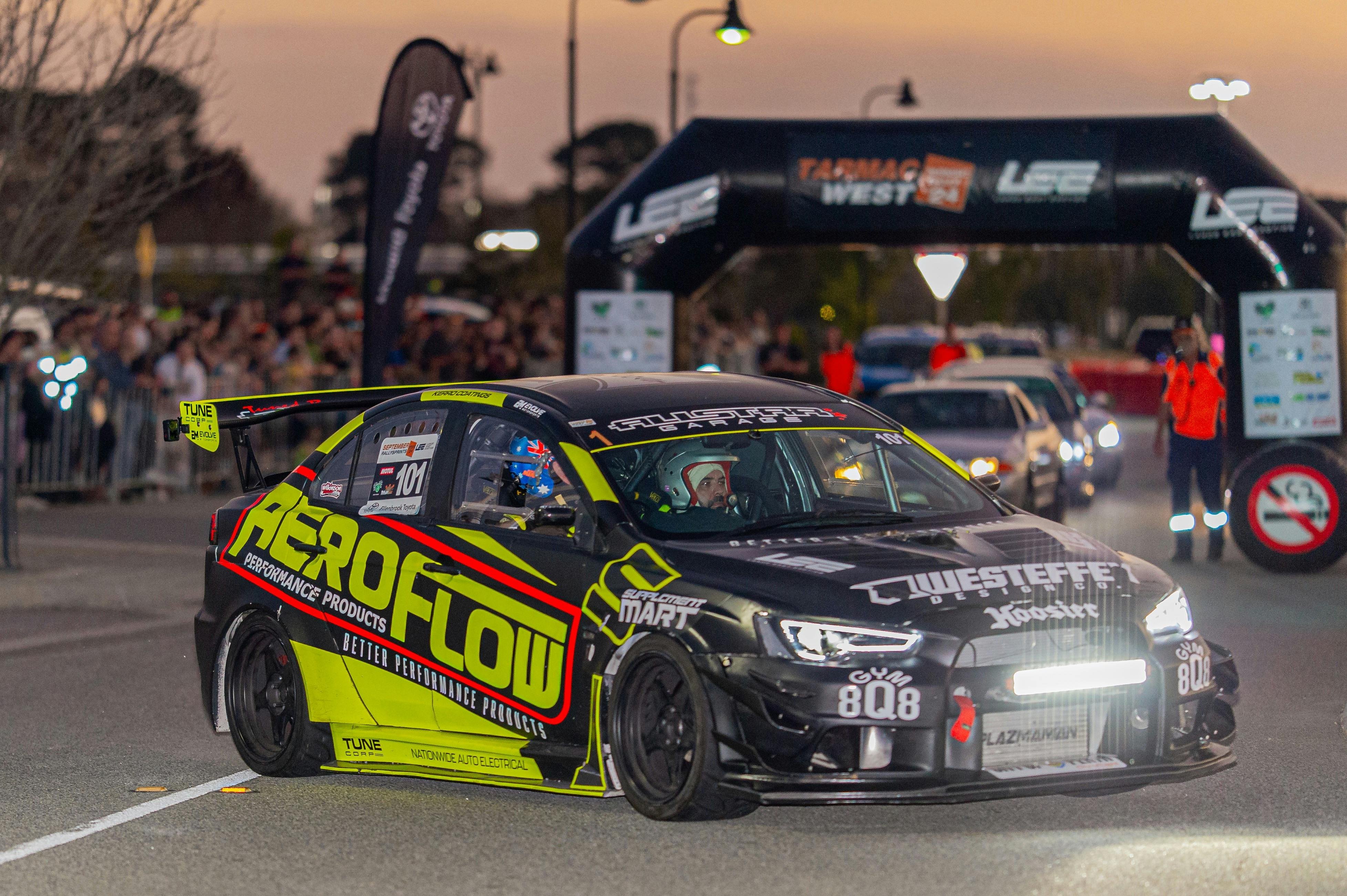 Rally car in Ellenbrook, crowd in background