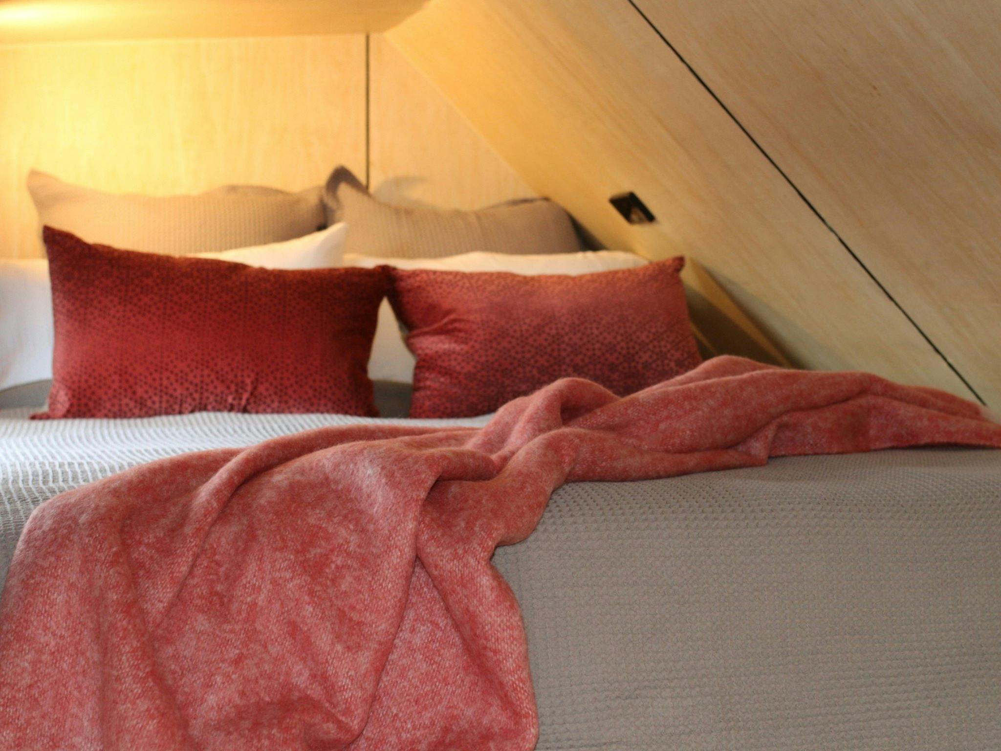Queen size bed in the loft, stairs are required to climb to get to the bed