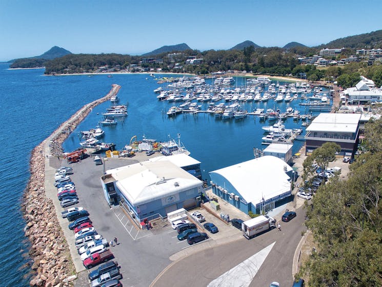 Arial photo Nelson Bay's Marina with NBFW as the prominent feature. Boats in the marina hills behind
