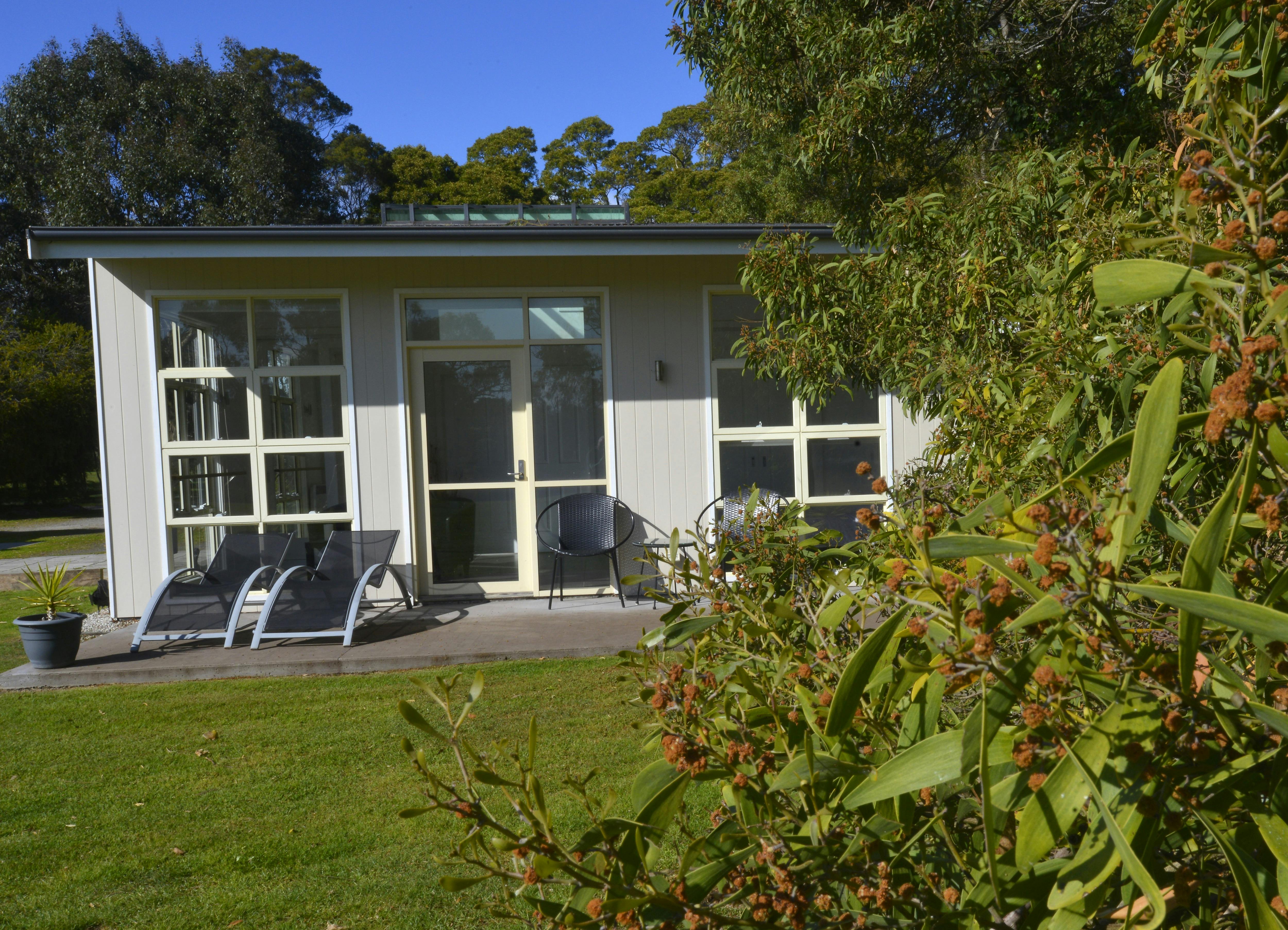 Sheltered patio with outdoor setting and loungers