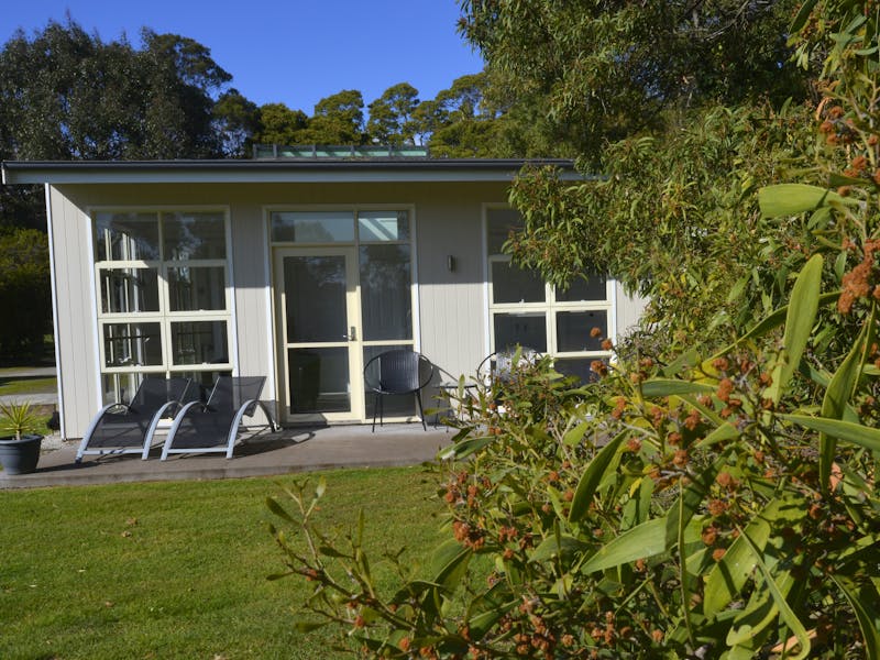 Sheltered patio with outdoor setting and loungers