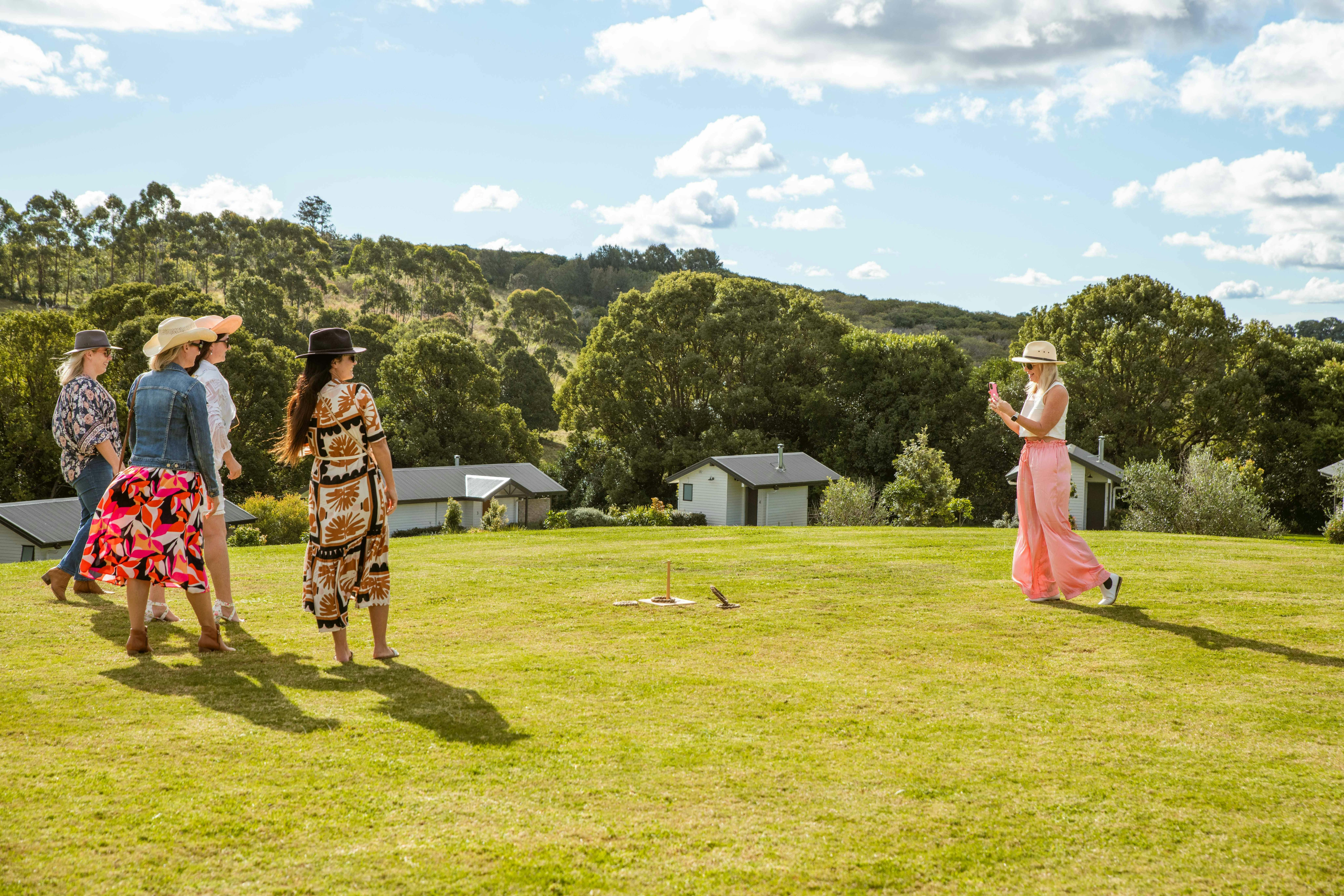 Image showing three female guests enjoying lawn games on a green lawn in the sun