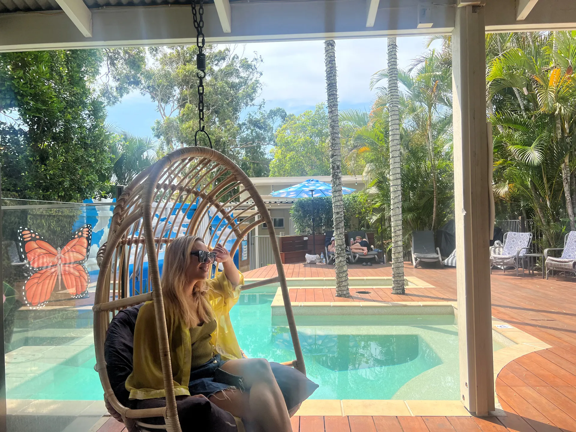 Egg hanging chair by the pool