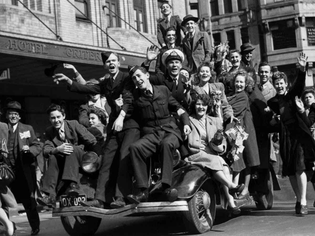 Plunging headlong and full-throatedly into celebration ...Revellers hitch a ride up Park Street.