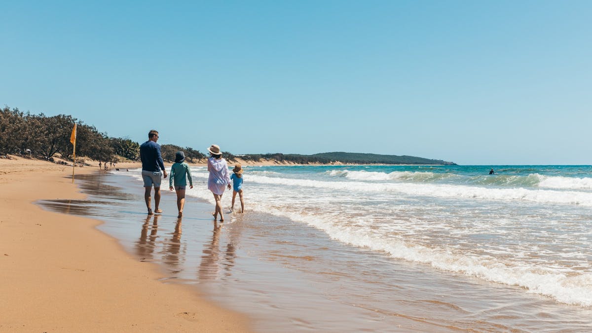 A family enjoying the picturesque views of Agnes Water Beach