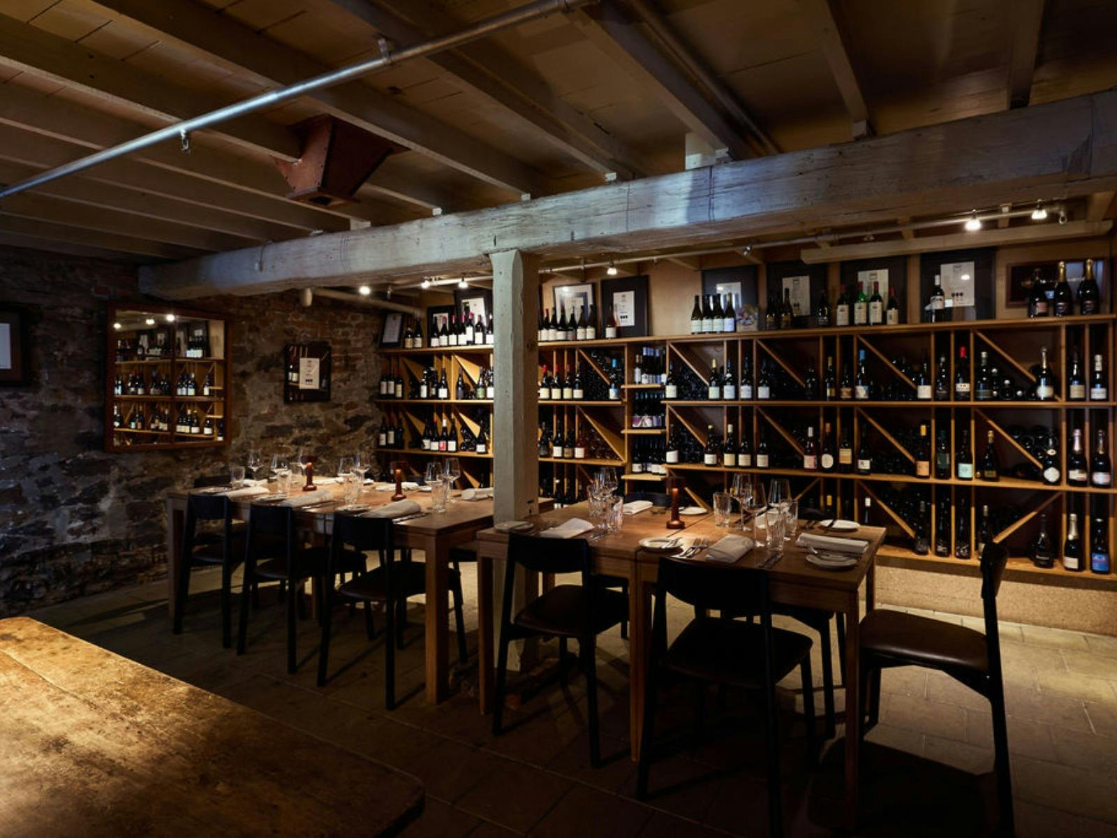Dimly lit cellar room with a long table