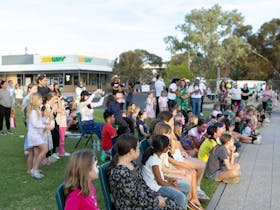 Shows the audience waiting for the show to start