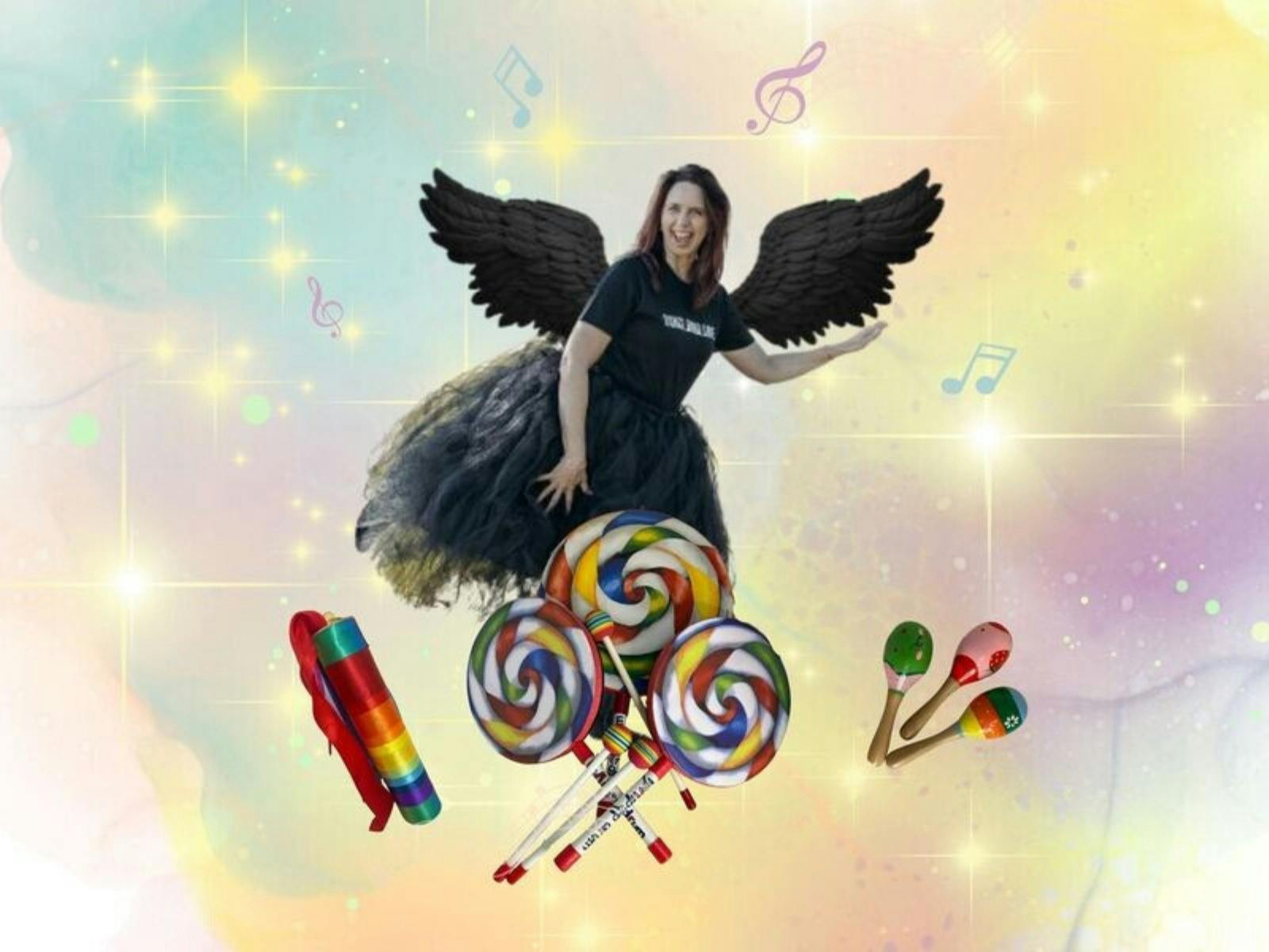 Lady in a black tulle skirt with black angel wings hovering over rainbow coloured candies