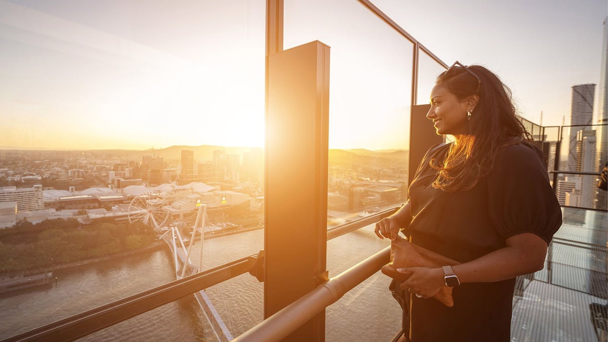 A woman looking at the view from Sky Deck A woman looking at the view from Sky Deck