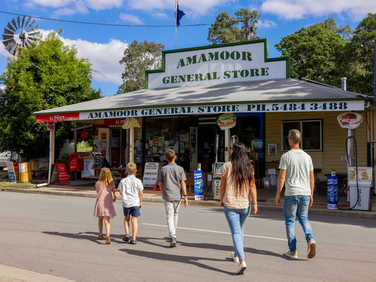 Family walking to Amamoor General Store