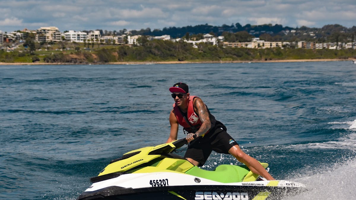 Person riding a Jet ski in the ocean at Mooloolaba Sunshine Coast