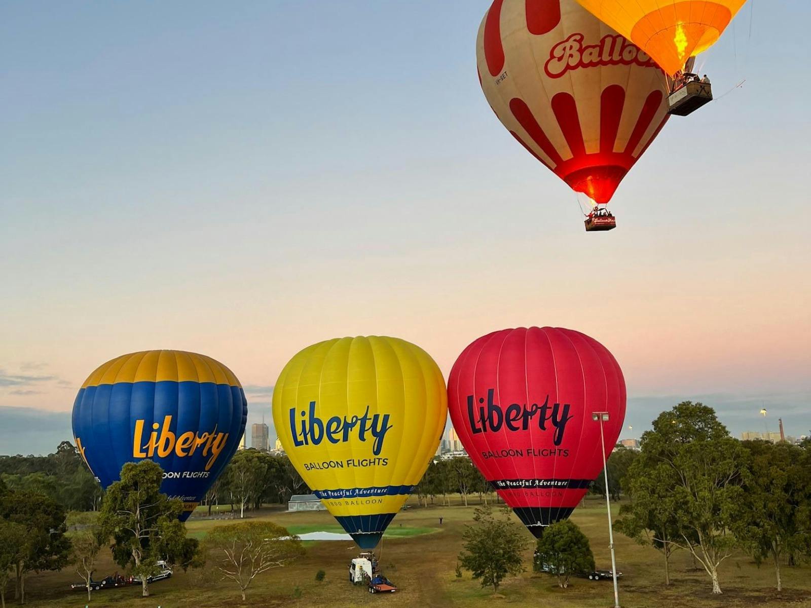Liberty Balloon Flights’ branded trio balloons starting their aerial adventure