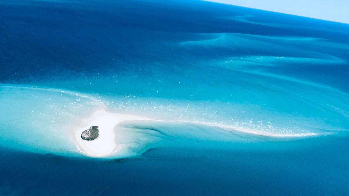 Helicopter Flying over Pelican Banks on low tide