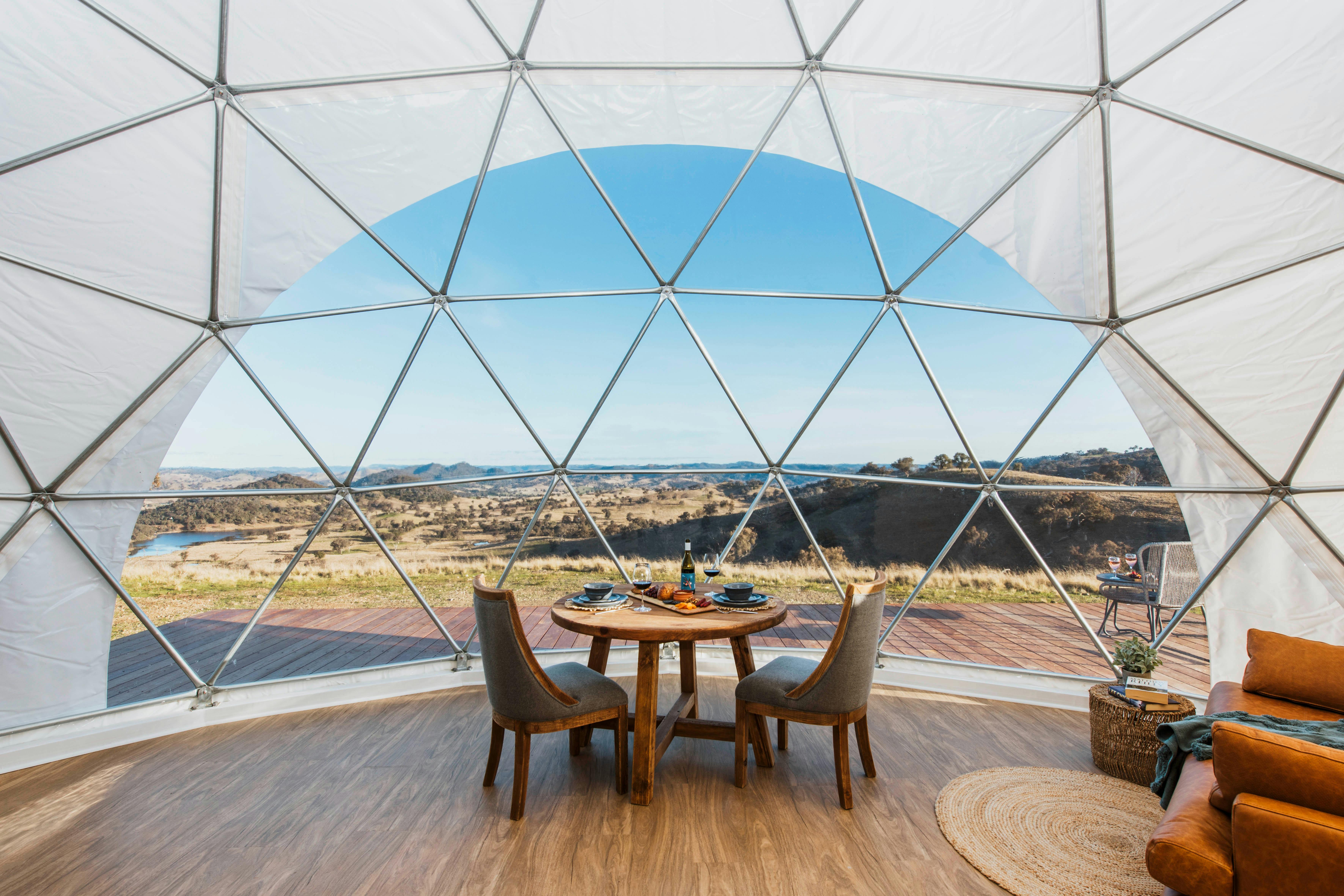 Panoramic window view looking outside of glamping dome