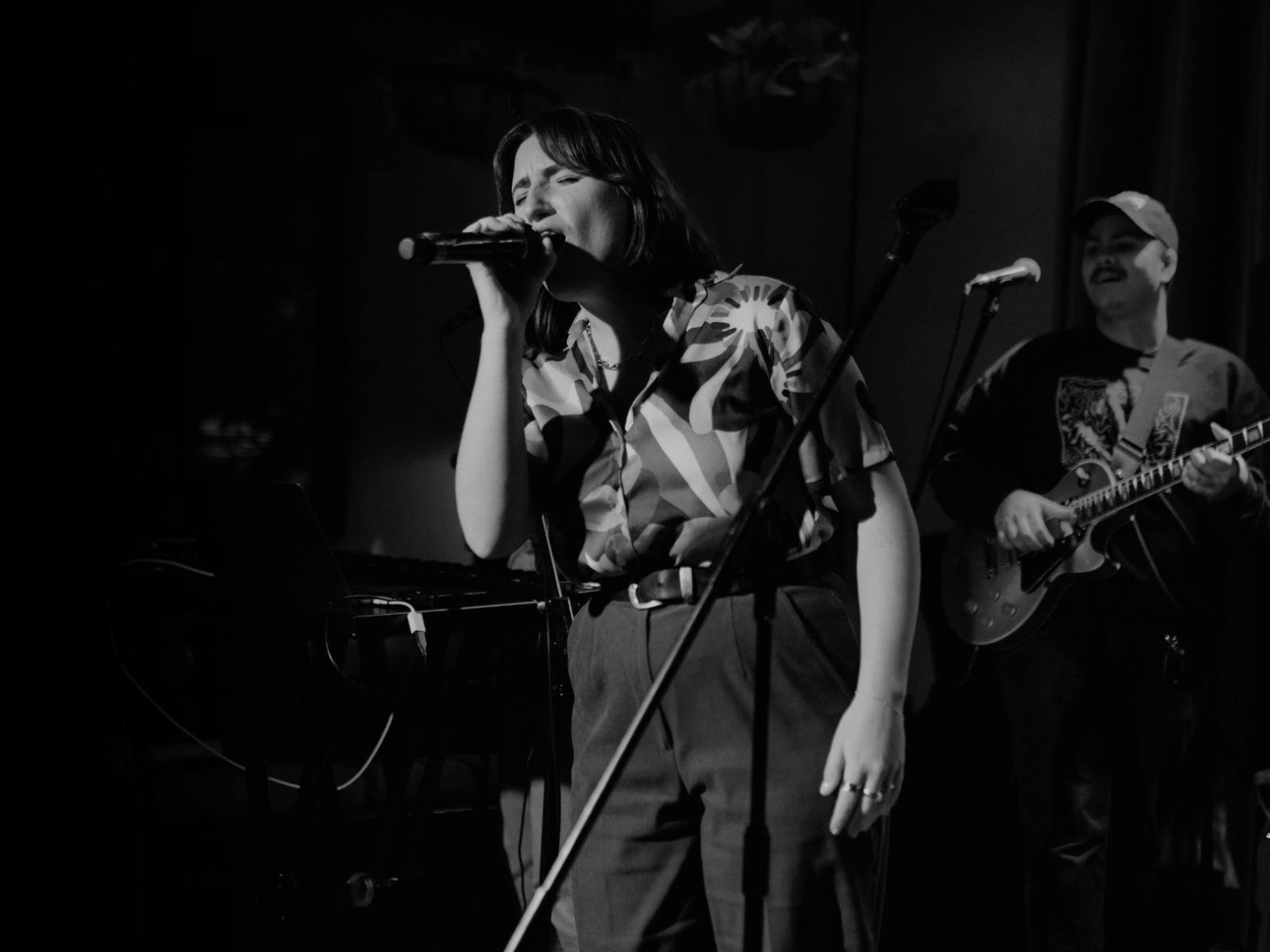 Woman singing into microphone