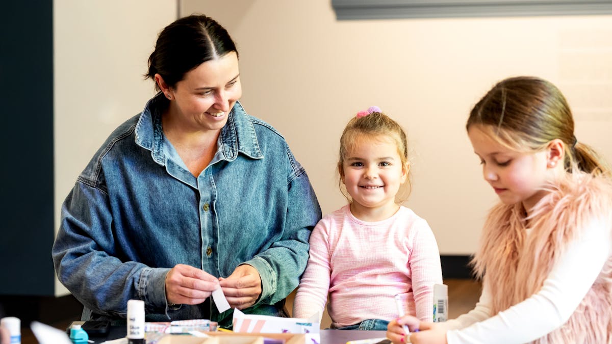 Little girls hanging out with their mum at the Museum and making different crafts