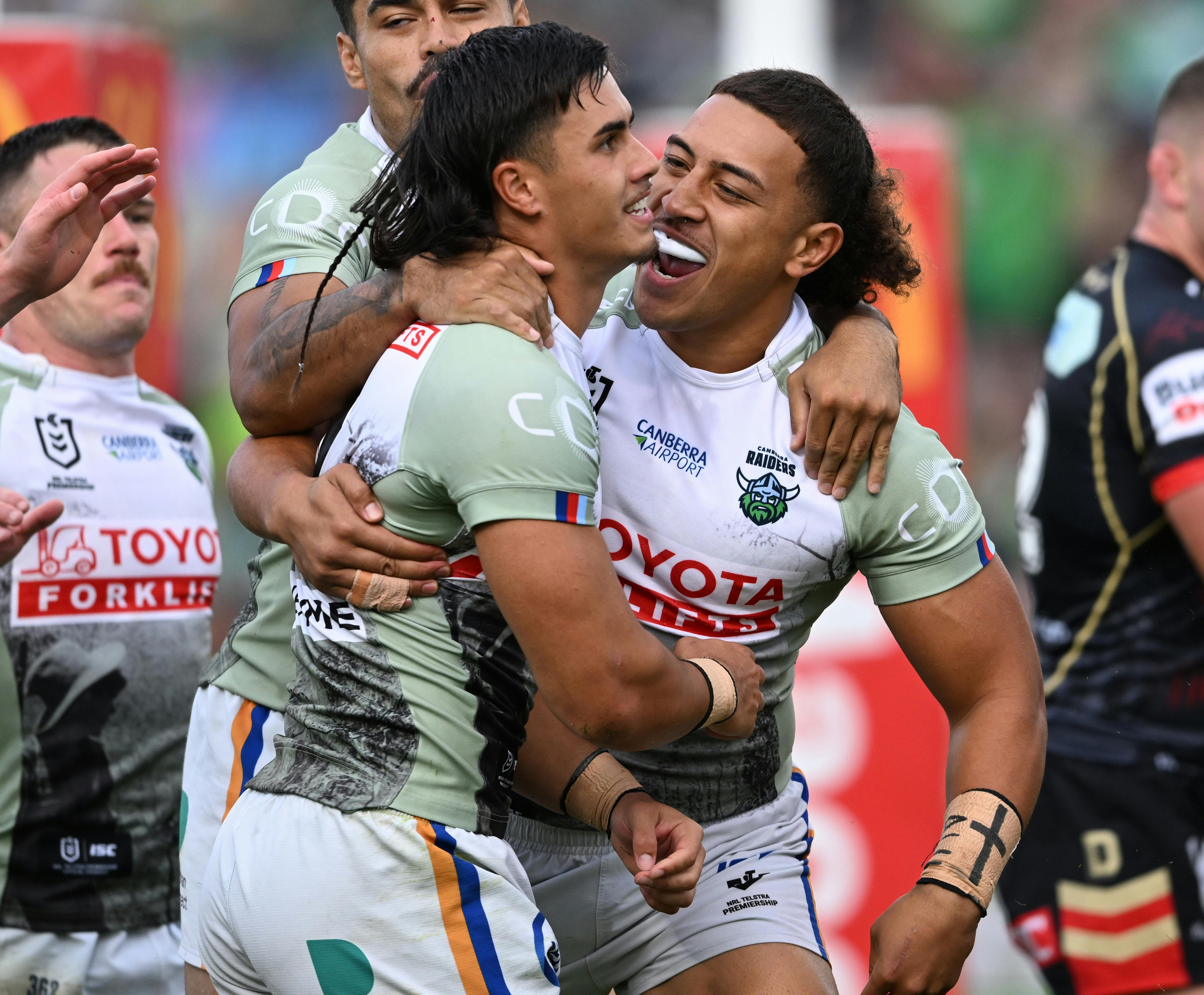 Canberra Raiders players Ata Mariota and Kaeo Weekes celebrating.
