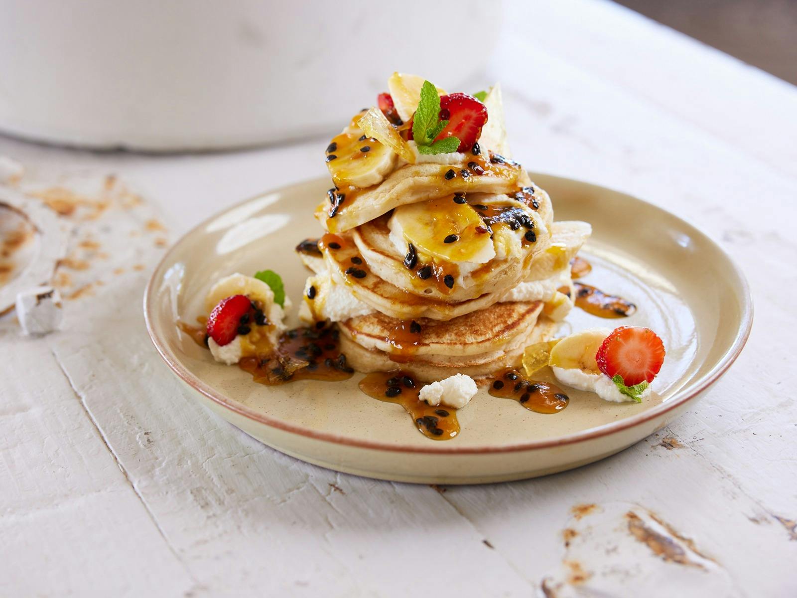 Pancake banana strawberry passionfruit cream