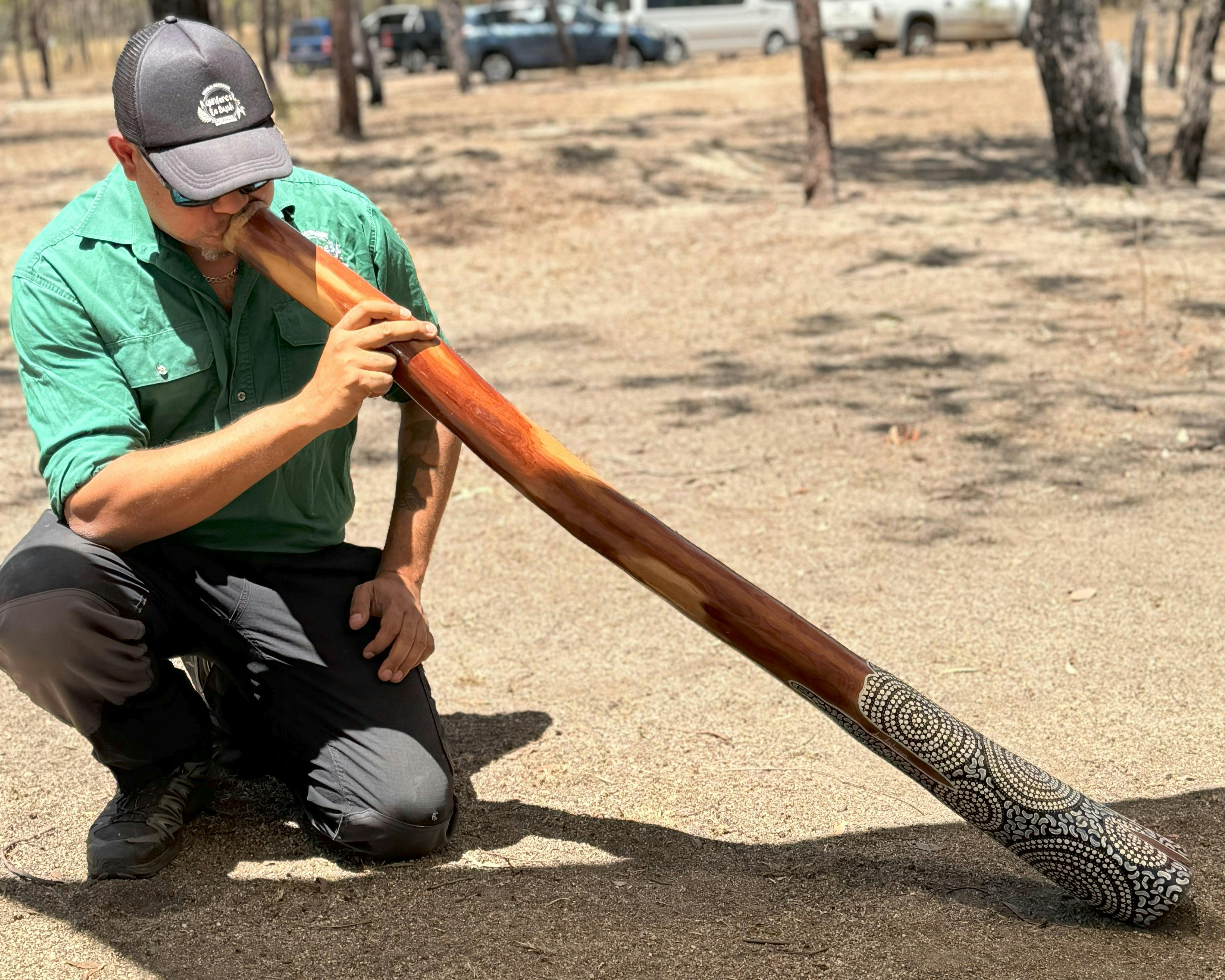 Tour guide gives a didgeridoo demonstration