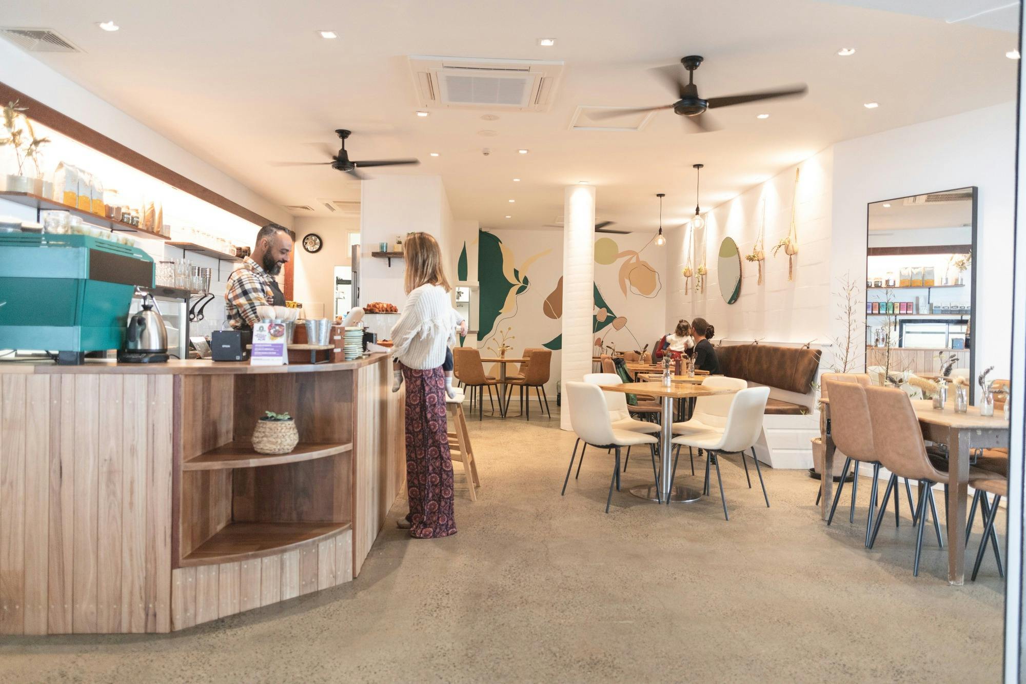 Luiz serving lady at cafe