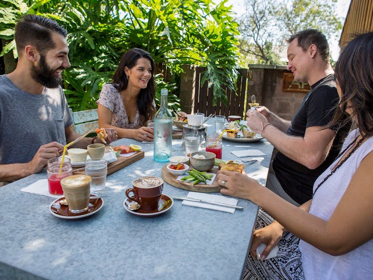 Friends enjoying a relaxed breakfast at Cafe Enzo, Pokolbin