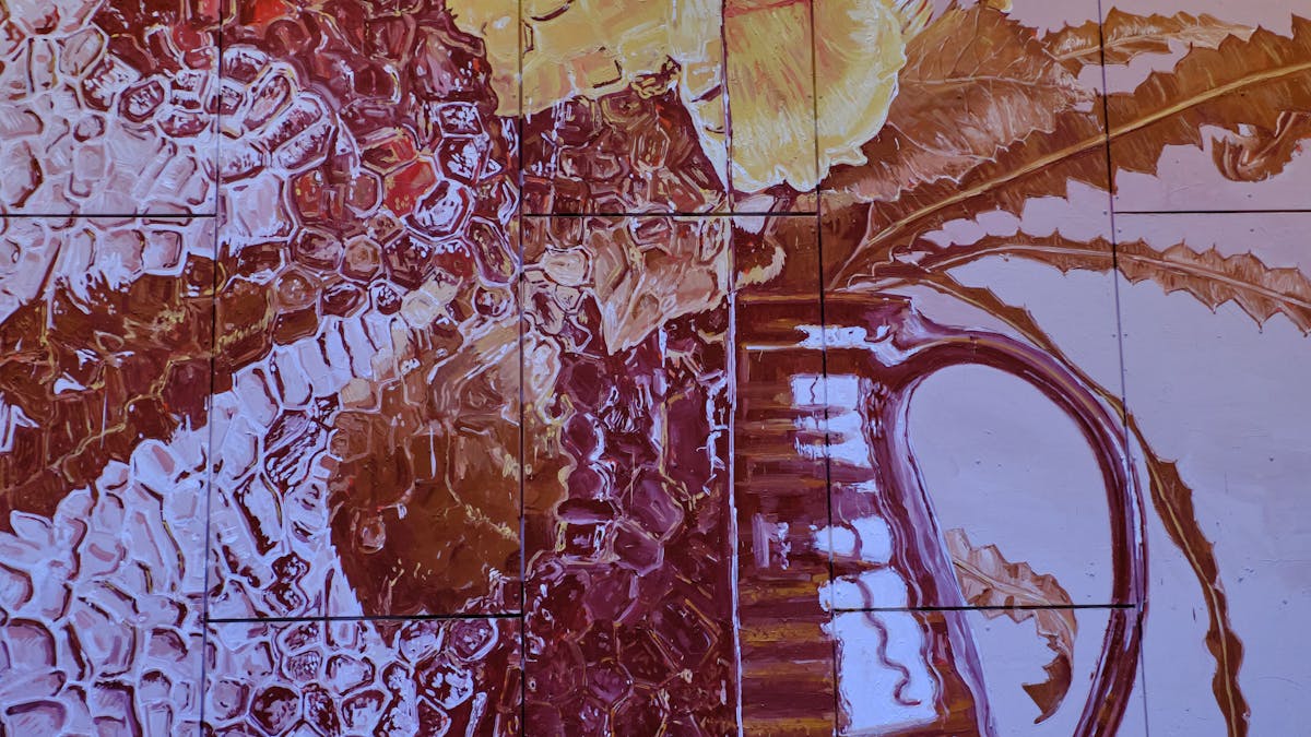 Street art of sepia and purple toned vase of flowers