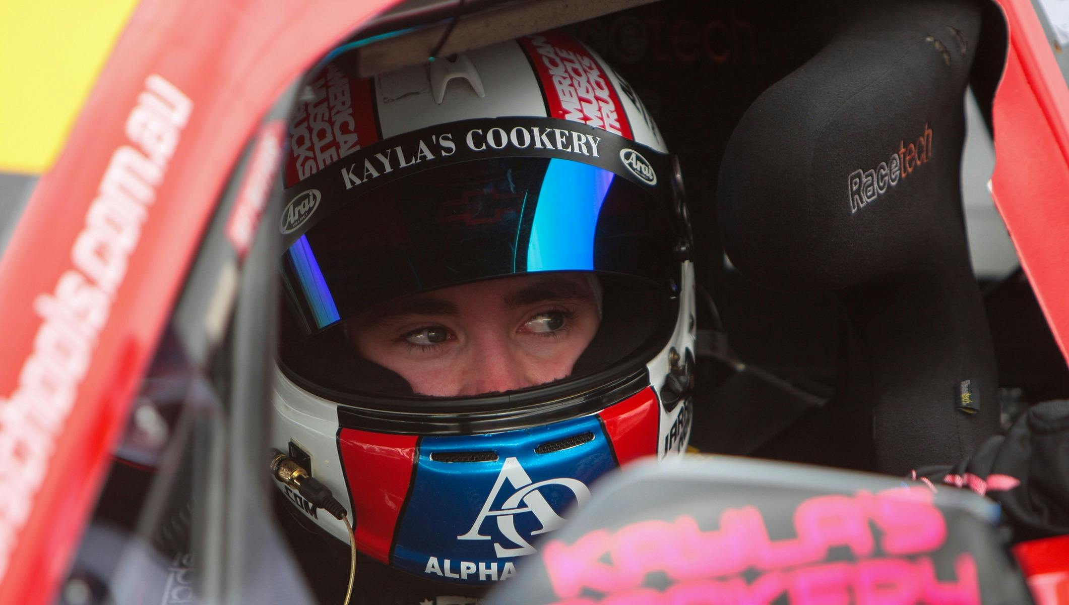 Racing car driver in car