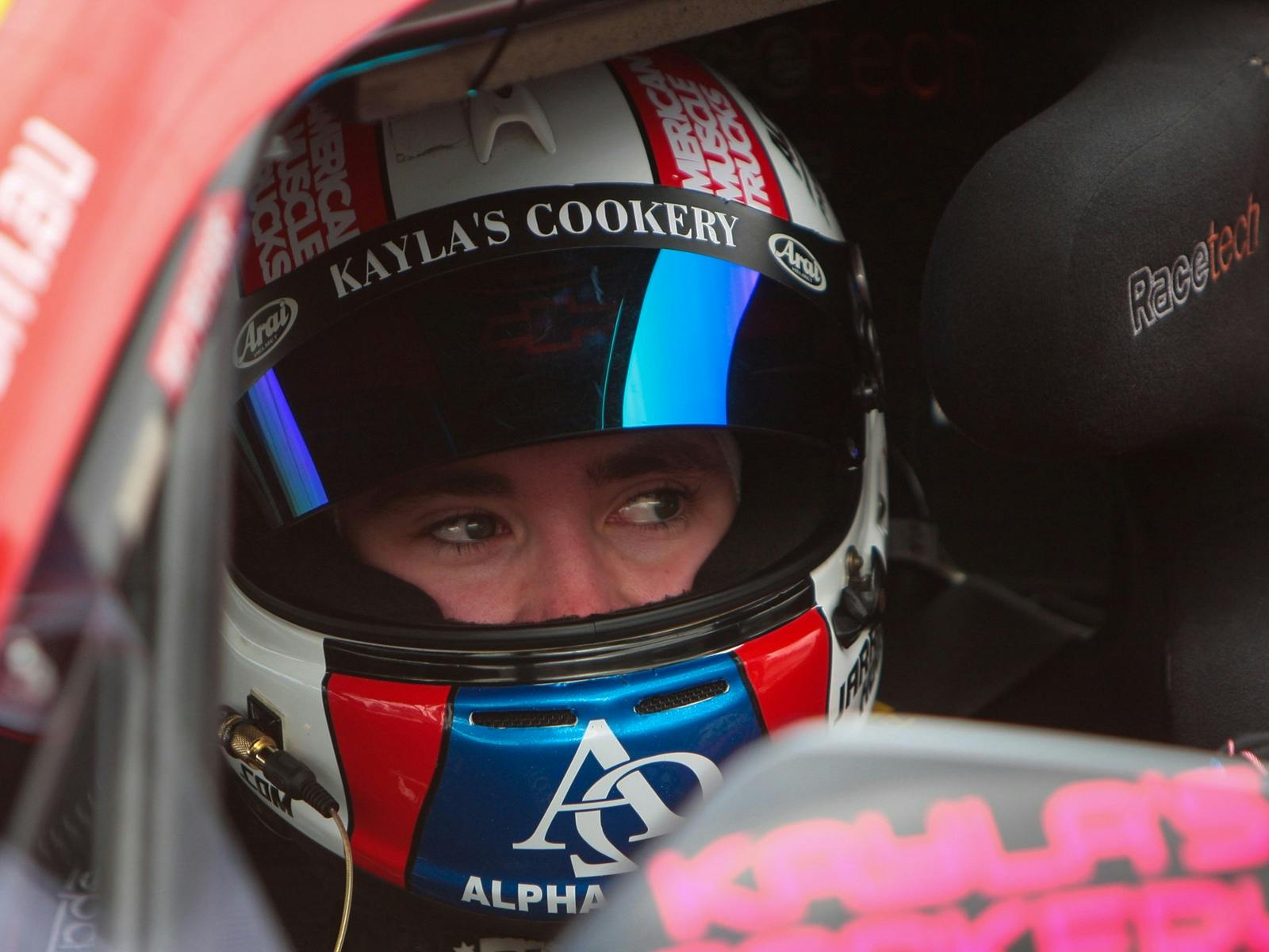 Racing car driver in car