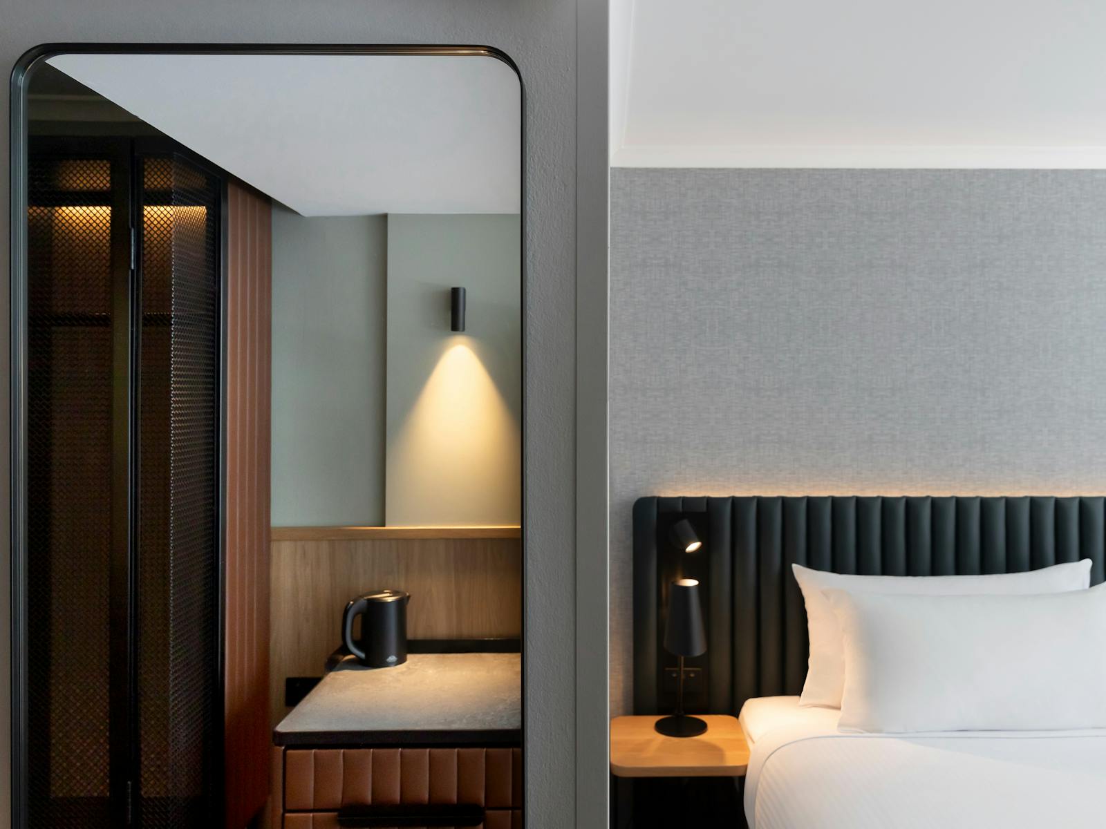 Picture of the Bed, side table, kitchenette and mirror